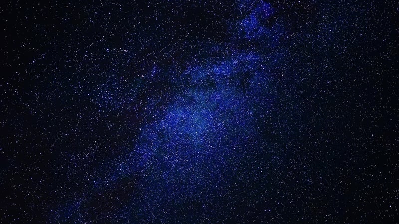 Starry night sky over a peaceful setting